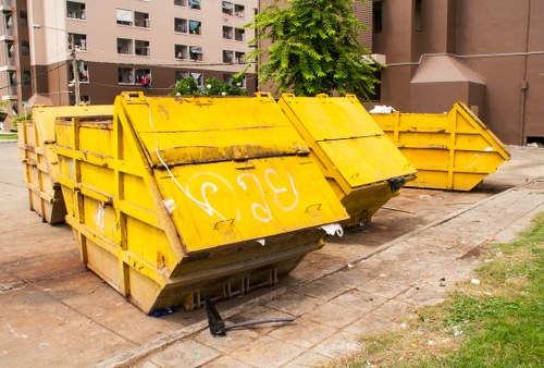 Professionals clearing a cluttered garage in Woolwich